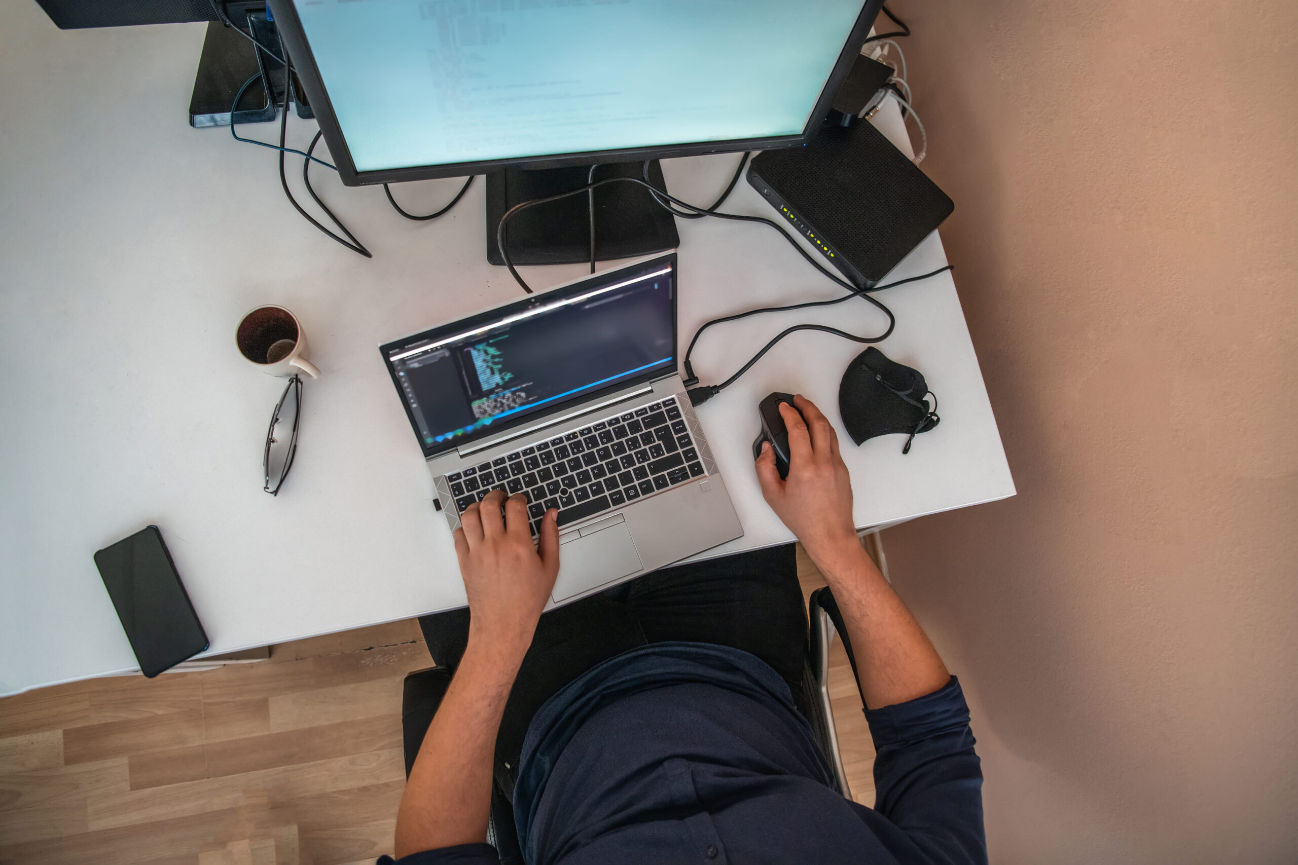 vecteezy_top-view-of-programmer-diligently-testing-smartphone_51765778 (1)